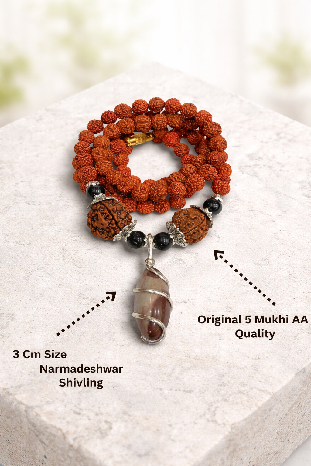 Buy original 5 Mukhi Rudraksha Mala with natural Narmadeshwar Shivling pendant. Perfect for meditation, peace, and daily wear. Authentic spiritual jewelry by Braj Mantra.